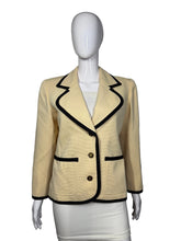 Load image into Gallery viewer, Mannequin wearing a beige suit with black accents on a plain background
