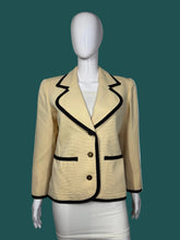 Load image into Gallery viewer, Mannequin wearing a beige suit with black accents on a plain background