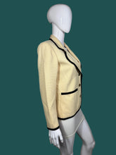 Load image into Gallery viewer, Mannequin wearing a beige jacket with black trim on a plain background