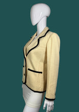 Load image into Gallery viewer, Cream jacket with black trim on a mannequin against a gray background