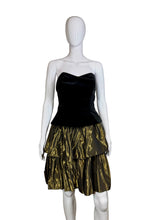 Load image into Gallery viewer, Black strapless dress with a gold tiered skirt on a mannequin against a plain background