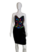 Load image into Gallery viewer, Mannequin wearing a black dress with colorful sequin top against a plain wall.