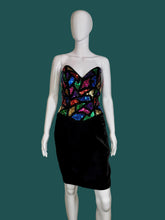 Load image into Gallery viewer, Mannequin wearing a black dress with colorful sequin top against a plain wall.
