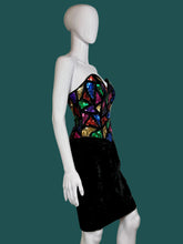 Load image into Gallery viewer, Mannequin wearing a black dress with colorful geometric patterns on a white background