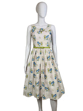 Load image into Gallery viewer, Floral dress on a mannequin against a plain wall