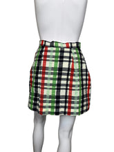 Load image into Gallery viewer, Plaid skirt on a mannequin against a plain wall.