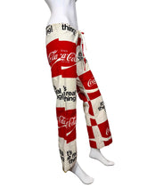 Load image into Gallery viewer, Mannequin wearing red and white Coca-Cola pants