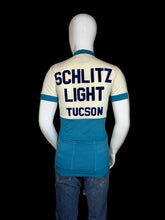 Load image into Gallery viewer, Mannequin wearing a vintage cycling jersey with 'Schlitz Light Tucson' text on a plain background