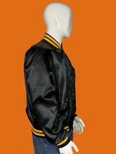 Load image into Gallery viewer, Mannequin wearing a black jacket with yellow stripes on a white background