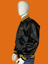 Load image into Gallery viewer, Mannequin wearing a black jacket with yellow accents on a white background