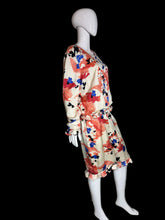 Load image into Gallery viewer, Floral dress on a mannequin against a white wall