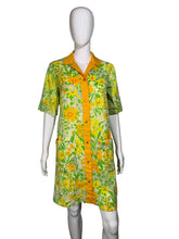 Load image into Gallery viewer, Mannequin wearing a floral dress with yellow accents against a plain background