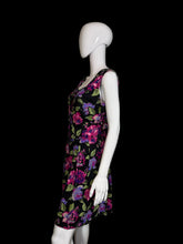 Load image into Gallery viewer, Black romper with colorful floral pattern on a mannequin against a white background