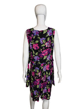 Load image into Gallery viewer, Black romper with colorful floral pattern on a mannequin, shown uncinched against a white background