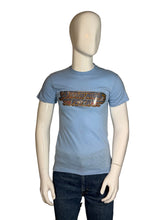 Load image into Gallery viewer, Blue t-shirt with graphic design on a mannequin against a plain background