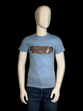 Load image into Gallery viewer, Blue t-shirt with graphic design on a mannequin against a plain background