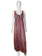 Load image into Gallery viewer, Mannequin wearing a colorful patterned dress against a plain wall.