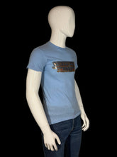Load image into Gallery viewer, Blue t-shirt with graphic design on a mannequin against a plain background