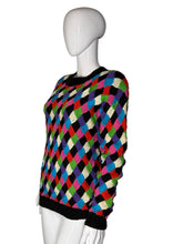 Load image into Gallery viewer, Multicolored checkered sweater on a white mannequin arm against a gray background