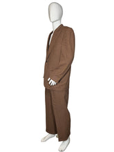 Load image into Gallery viewer, Brown pants on a mannequin against a white wall.
