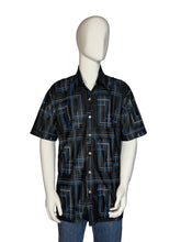 Load image into Gallery viewer, Mannequin wearing a black and blue patterned shirt on a plain background