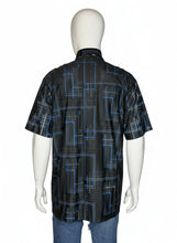 Load image into Gallery viewer, Black and blue geometric patterned shirt on a mannequin against a white background