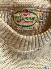 Load image into Gallery viewer, Close-up of a Welgrume label on a textured fabric background