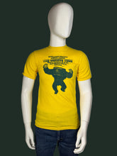 Load image into Gallery viewer, Yellow t-shirt with graphic design on a mannequin against a white background