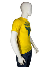 Load image into Gallery viewer, Mannequin wearing a yellow t-shirt with a graphic design on a plain background
