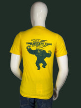 Load image into Gallery viewer, Yellow t-shirt with graphic design on a mannequin against a white background