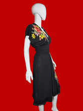 Load image into Gallery viewer, Mannequin wearing a black dress with floral embroidery on a white background
