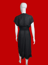 Load image into Gallery viewer, Black dress on a mannequin against a plain wall.