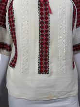 Load image into Gallery viewer, Embroidered fabric with red and black patterns on a white background