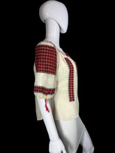 Load image into Gallery viewer, White peasant blouse with red accents on a mannequin against a white background