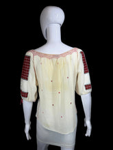 Load image into Gallery viewer, White peasant blouse with red accents on a mannequin against a white background
