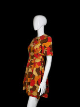 Load image into Gallery viewer, Mannequin wearing a colorful patterned dress against a plain background