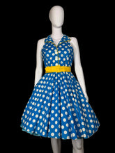 Load image into Gallery viewer, Blue polka dot dress on a mannequin against a plain background