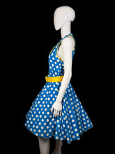 Load image into Gallery viewer, Mannequin wearing a blue dress with white polka dots and a yellow belt against a plain background