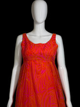 Load image into Gallery viewer, Mannequin wearing an orange and pink patterned dress on a plain background