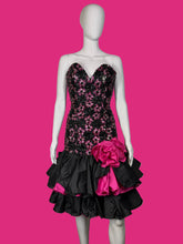 Load image into Gallery viewer, A mannequin wearing a black sequin and lace cocktail dress against a white background.
