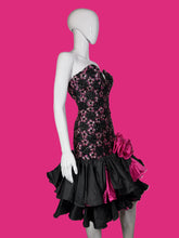 Load image into Gallery viewer, A mannequin wearing a black sequin and lace cocktail dress against a white background.