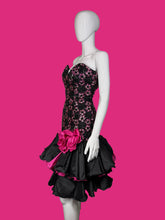 Load image into Gallery viewer, A mannequin wearing a black sequin and lace cocktail dress against a white background.
