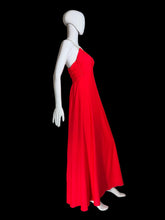 Load image into Gallery viewer, An evening gown on a mannequin against a plain background.