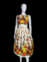 Load image into Gallery viewer, Floral dress on a mannequin against a white background