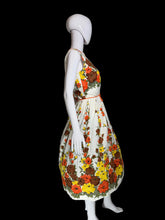 Load image into Gallery viewer, Floral dress on a mannequin against a plain background
