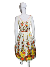 Load image into Gallery viewer, Floral dress on a mannequin against a plain background