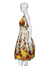 Load image into Gallery viewer, Floral dress on a mannequin against a plain background