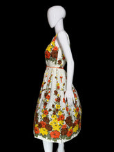 Load image into Gallery viewer, Floral dress on a mannequin against a plain background