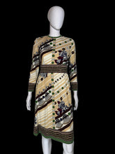 Load image into Gallery viewer, A patterned vintage dress against a white background.
