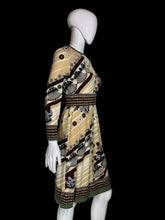 Load image into Gallery viewer, A patterned vintage dress against a white background.